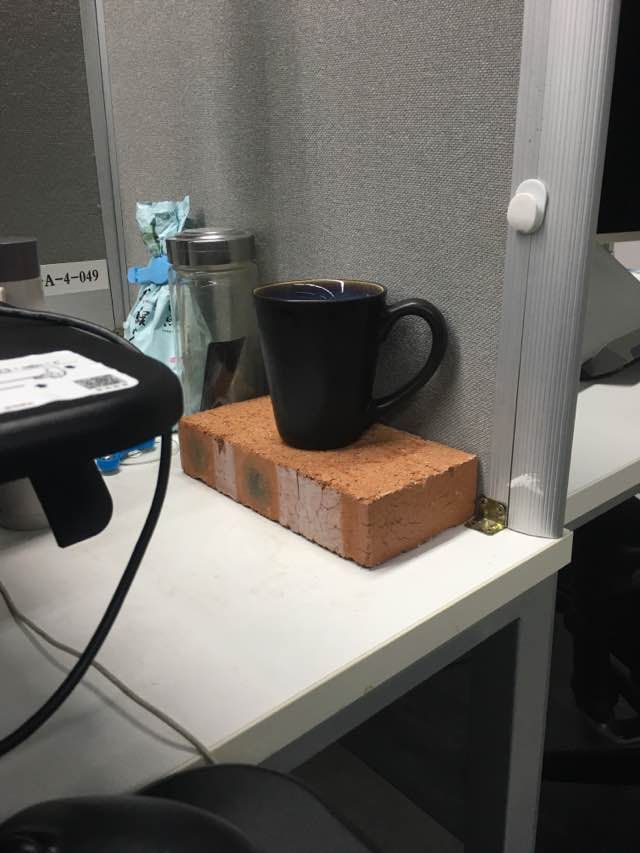 Brick on programmer desk